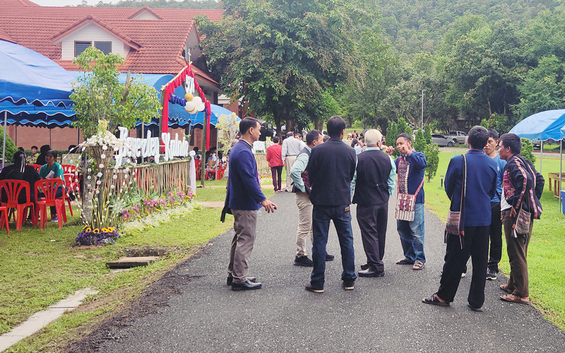 Guests gathering on the campus grounds
